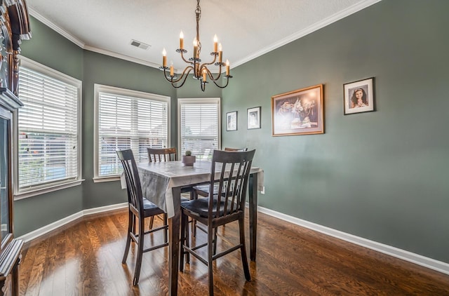 dining space featuring crown molding, a notable chandelier, and dark hardwood / wood-style flooring