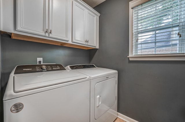 laundry area with cabinets and independent washer and dryer