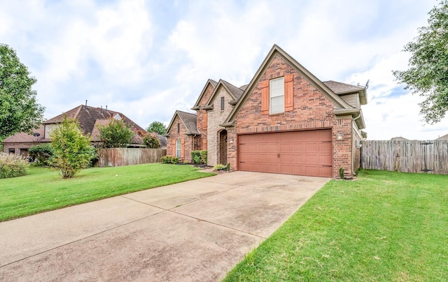 view of front of property featuring a garage and a front lawn