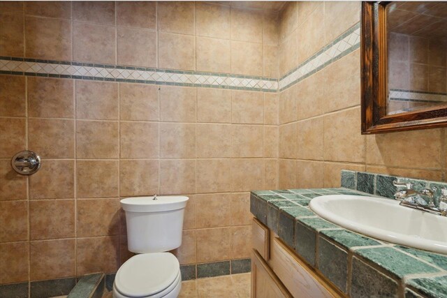 bathroom featuring a textured ceiling and vanity