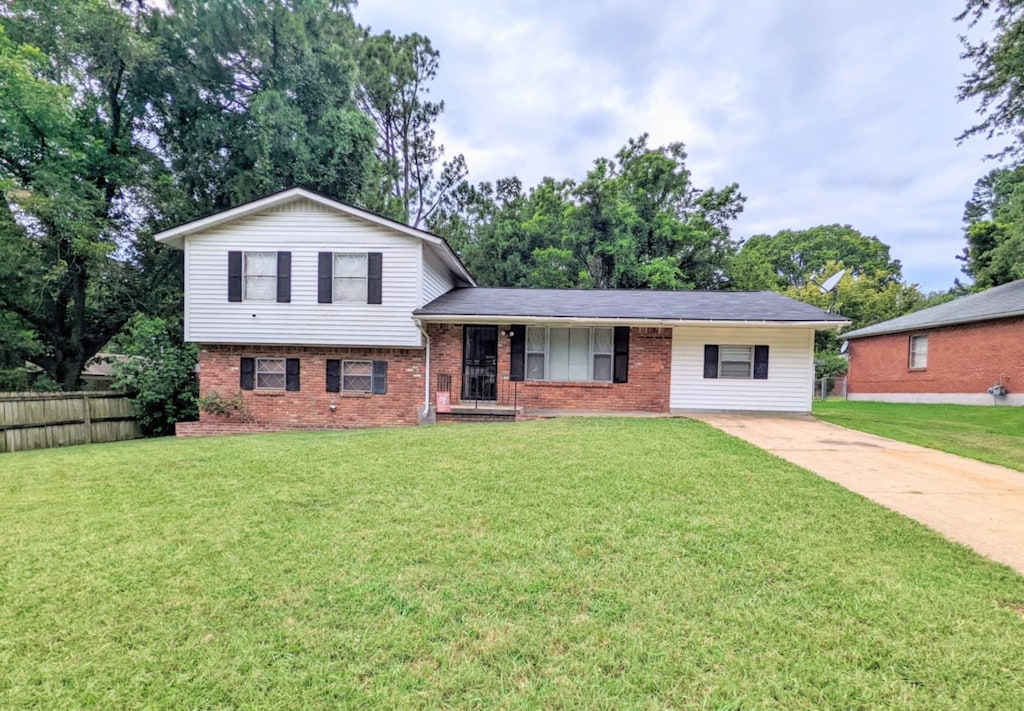 split level home with a front yard