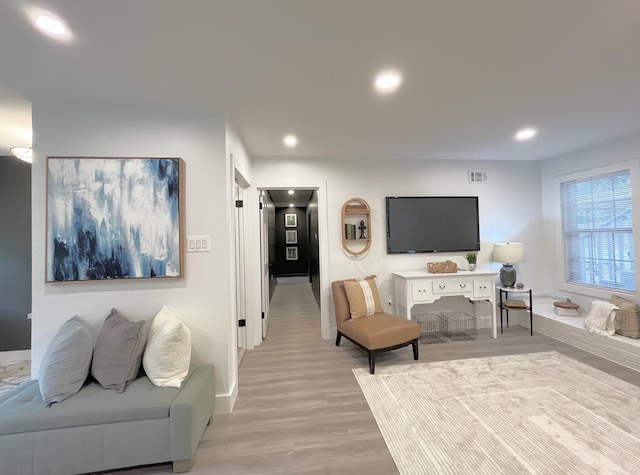 living room with light hardwood / wood-style floors