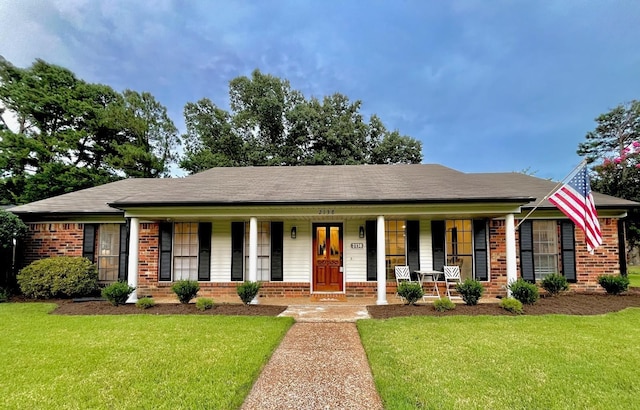 single story home with a front yard and a porch