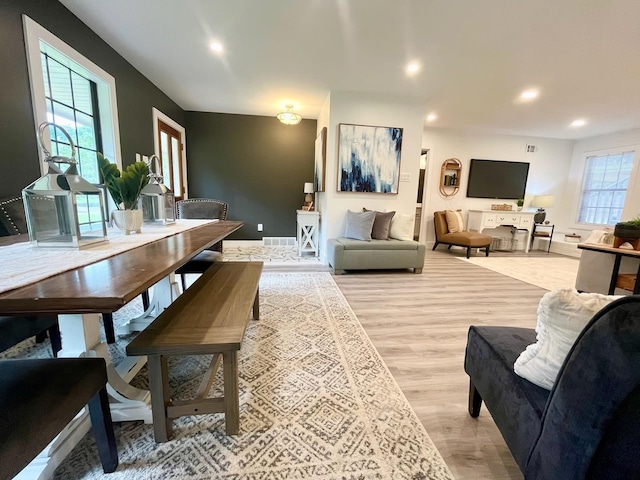 living room with light hardwood / wood-style flooring