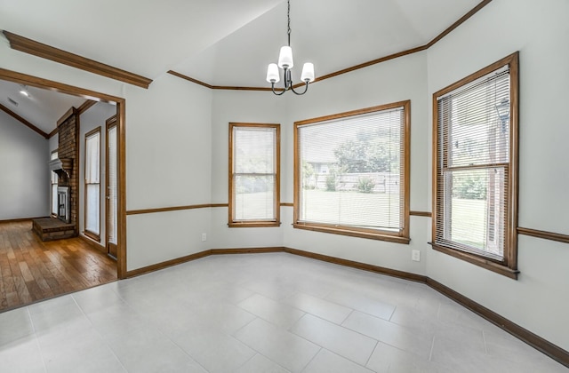 unfurnished room with tile patterned flooring, lofted ceiling, brick wall, and an inviting chandelier