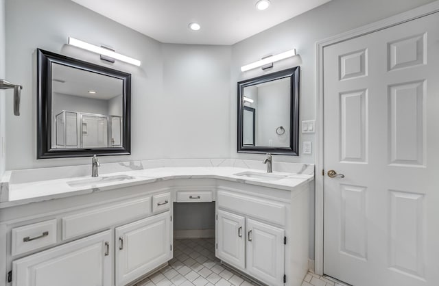 bathroom with dual vanity and tile patterned flooring