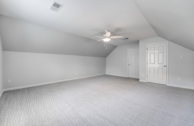 additional living space featuring carpet, ceiling fan, and lofted ceiling