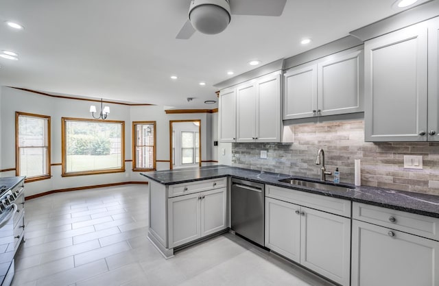 kitchen with dishwasher, a peninsula, plenty of natural light, and a sink