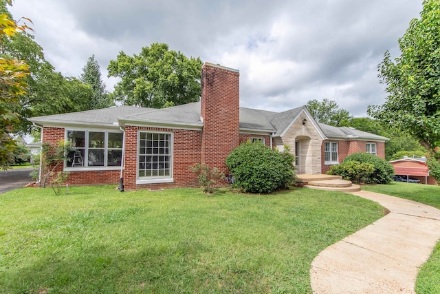 ranch-style house with a front lawn