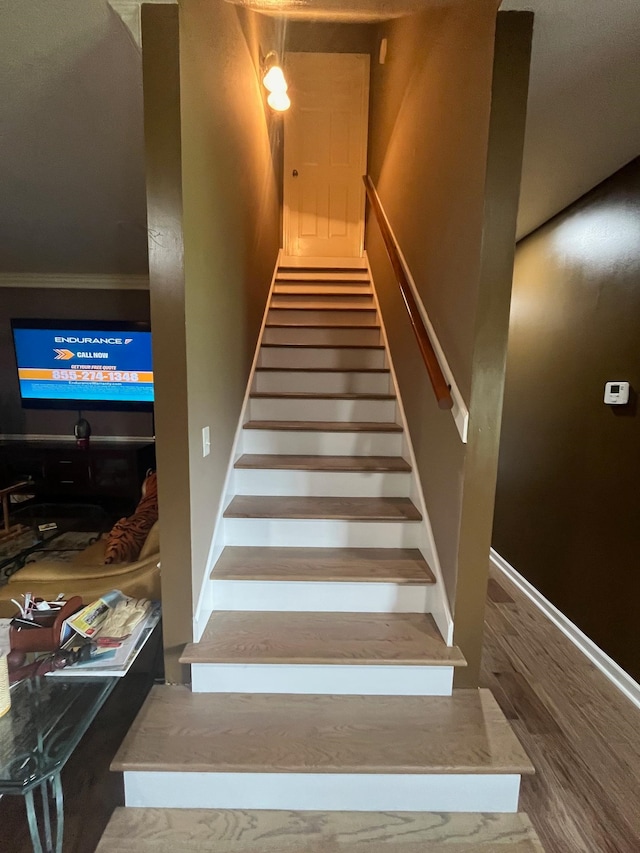 stairs with hardwood / wood-style floors