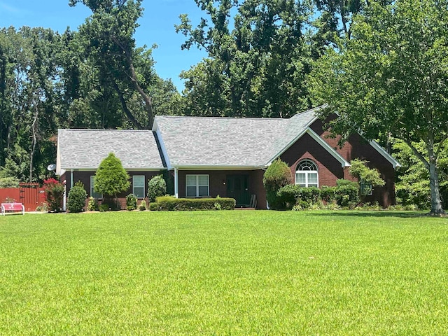 ranch-style house featuring a front lawn