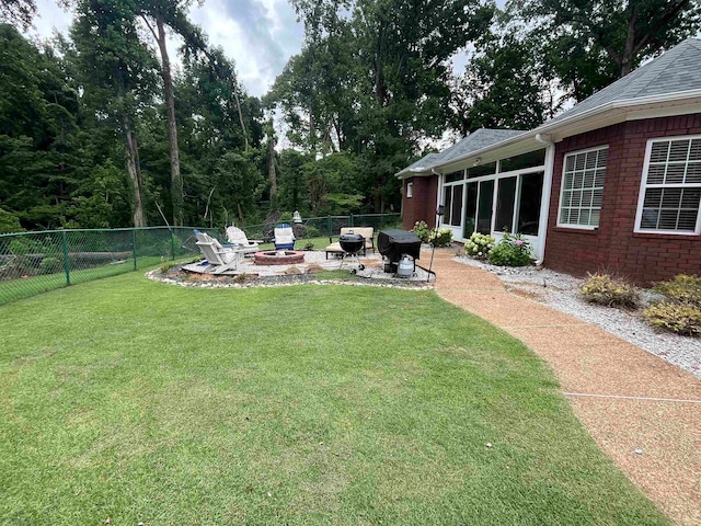 view of yard with a patio area and a fire pit