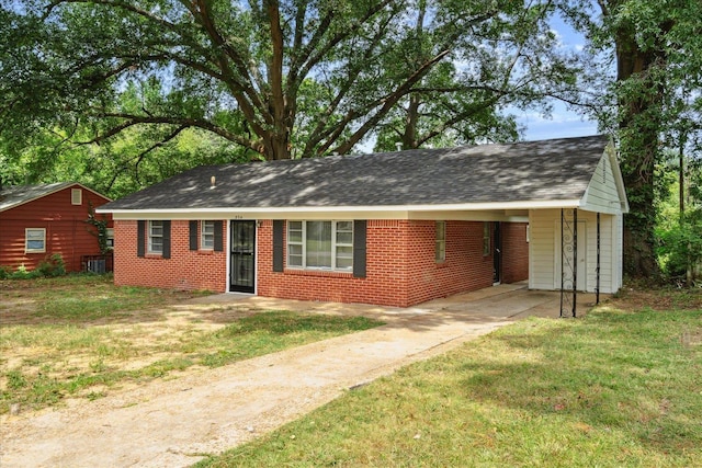 single story home with a carport and a front yard