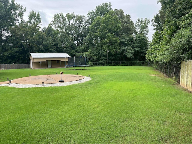 view of yard with a trampoline