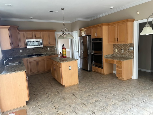 kitchen featuring sink, backsplash, a kitchen island, and appliances with stainless steel finishes