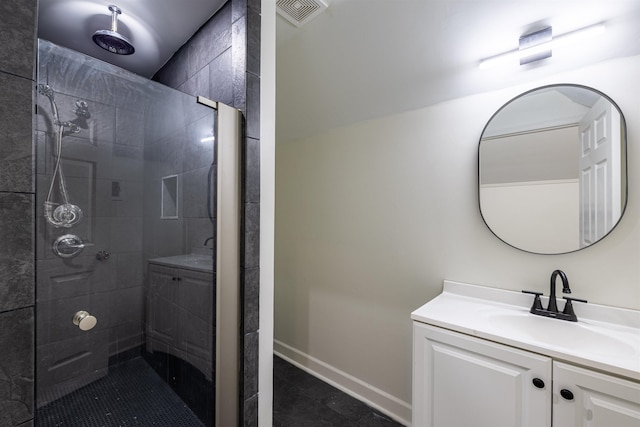 bathroom with vanity and a shower with shower door