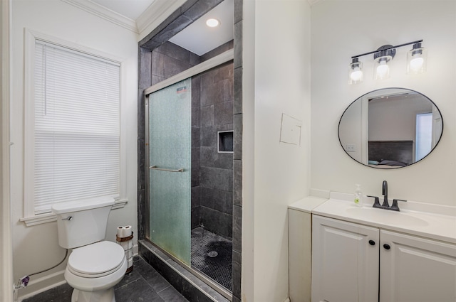 bathroom with crown molding, a shower with door, vanity, tile patterned floors, and toilet