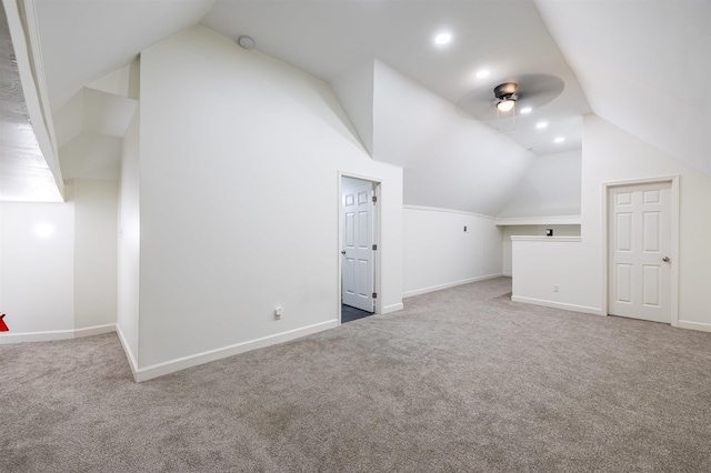 additional living space with ceiling fan, lofted ceiling, and carpet floors