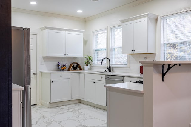 kitchen with sink, white cabinetry, crown molding, kitchen peninsula, and decorative backsplash