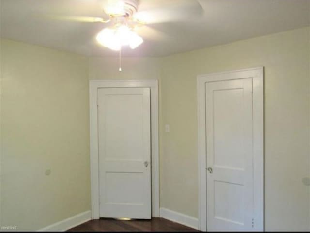 unfurnished bedroom featuring ceiling fan