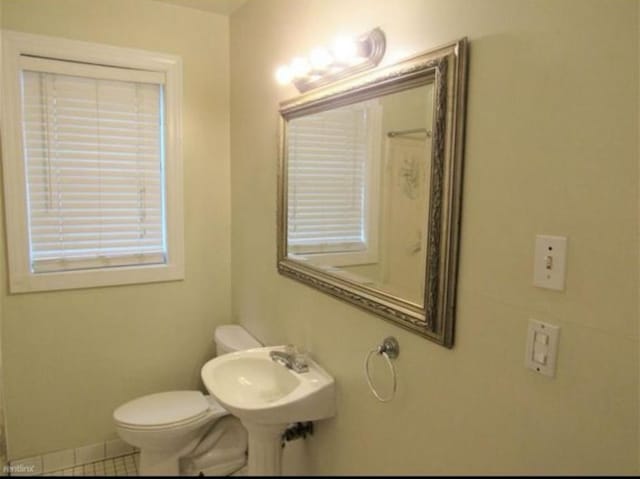 bathroom featuring tile patterned floors, sink, and toilet