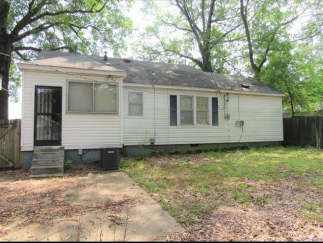 back of house featuring cooling unit