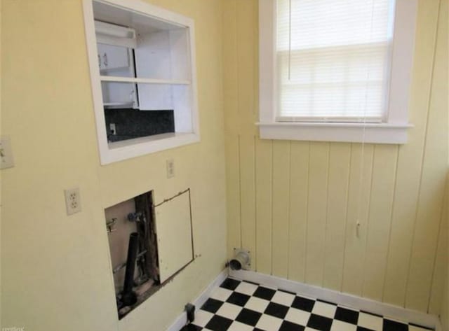 laundry room with tile patterned flooring and hookup for a washing machine