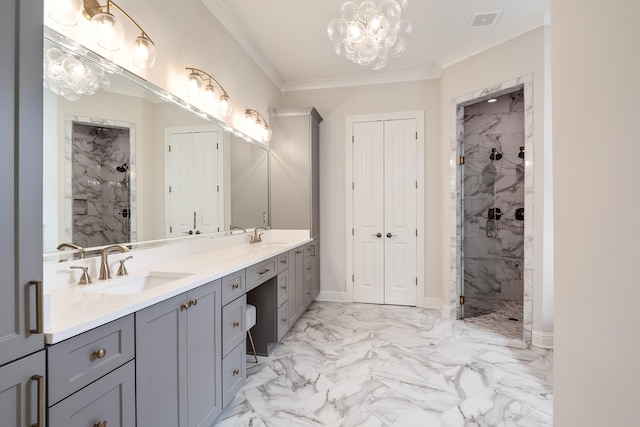 bathroom with tiled shower, double sink vanity, ornamental molding, an inviting chandelier, and tile patterned flooring