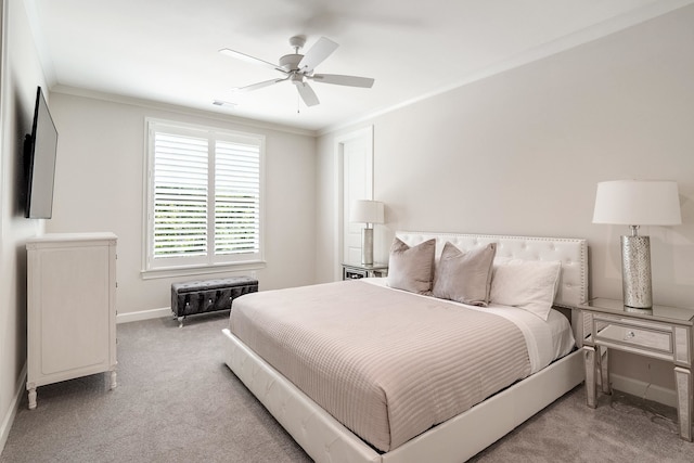 bedroom with ceiling fan, light carpet, and ornamental molding