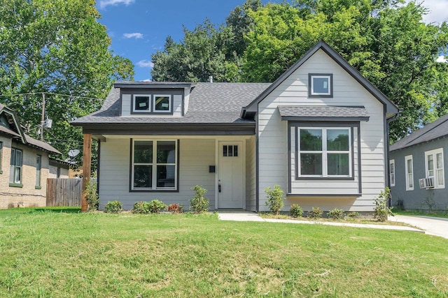 view of front of house featuring a front yard and covered porch