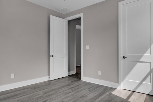 unfurnished bedroom with light wood-type flooring