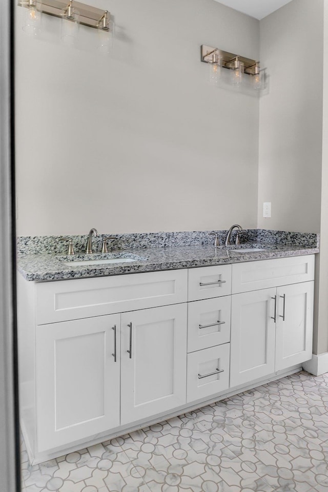 bathroom with tile patterned flooring and vanity