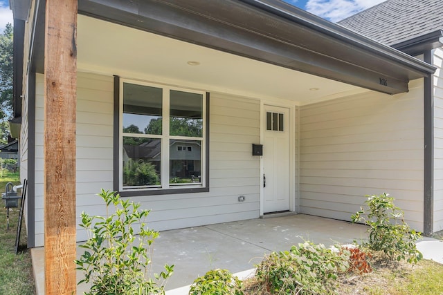 property entrance featuring a patio area