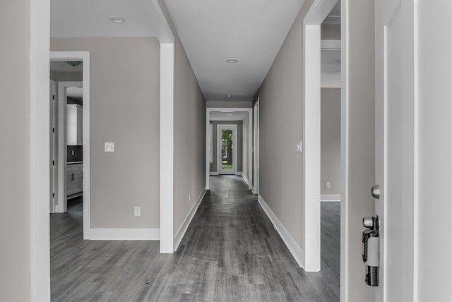 hall with hardwood / wood-style floors