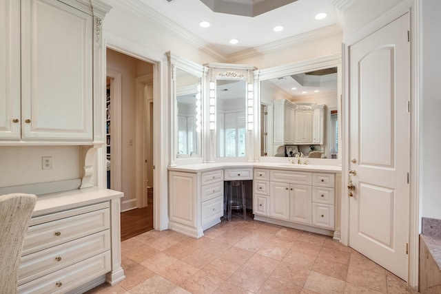 bathroom featuring vanity and ornamental molding