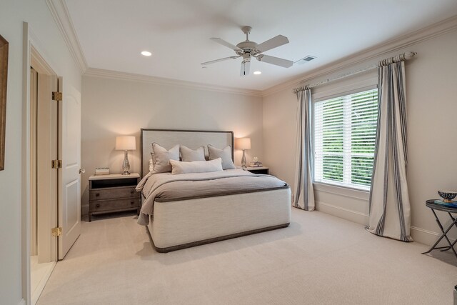 bedroom with light carpet, crown molding, and ceiling fan