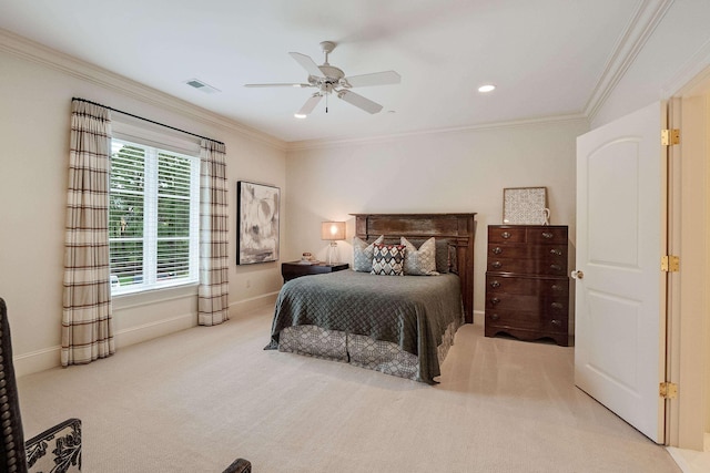 carpeted bedroom with ornamental molding and ceiling fan