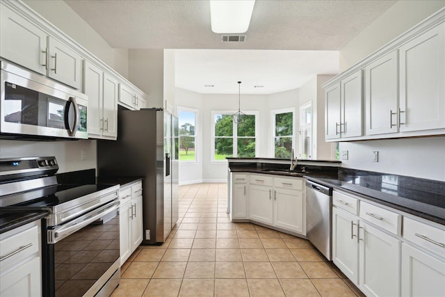 kitchen featuring white cabinetry, stainless steel appliances, and sink