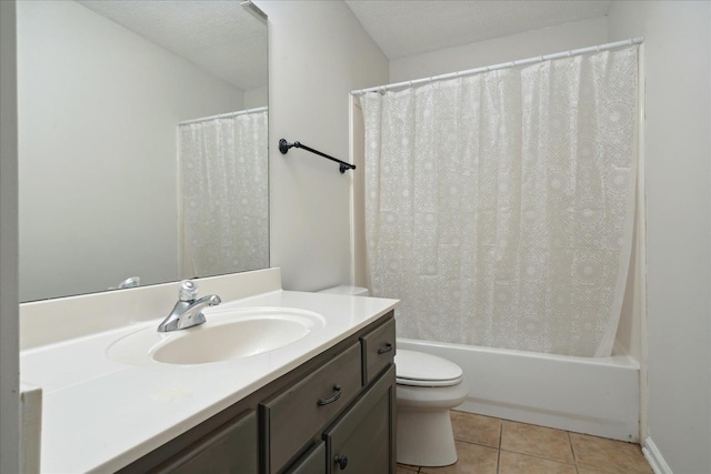 full bathroom featuring vanity, a textured ceiling, tile patterned floors, and toilet