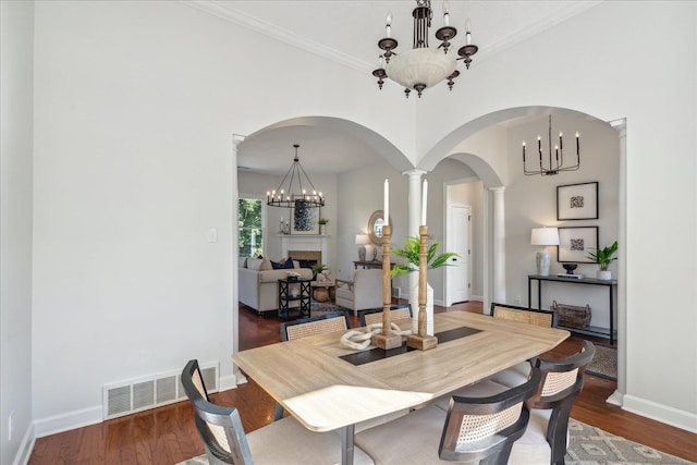 dining room featuring dark hardwood / wood-style floors and a chandelier