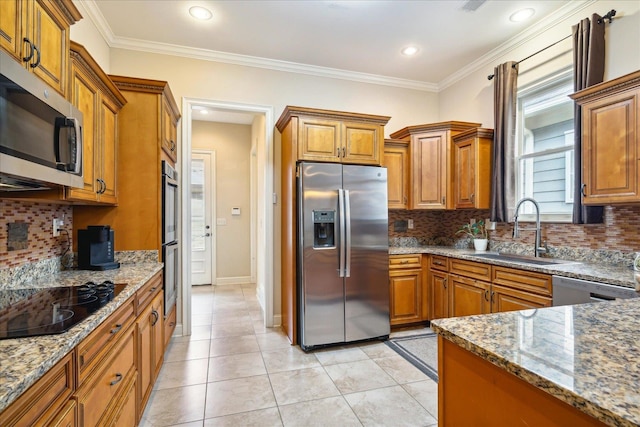 kitchen featuring light tile patterned floors, backsplash, appliances with stainless steel finishes, and sink