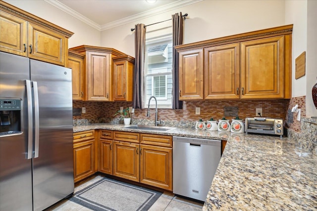 kitchen with sink, light stone countertops, backsplash, and stainless steel appliances