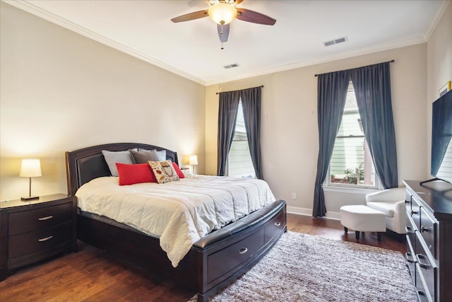 bedroom featuring ceiling fan, crown molding, and dark hardwood / wood-style flooring