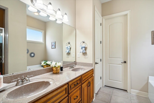 bathroom featuring double vanity, a sink, a bathing tub, and tile patterned floors