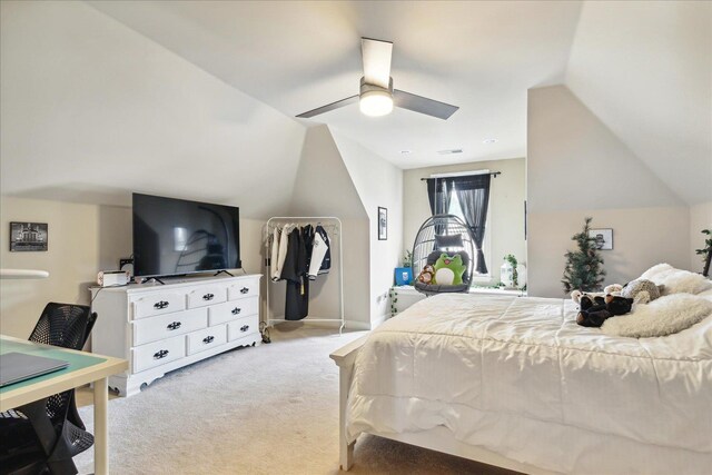 bedroom featuring light carpet, vaulted ceiling, and ceiling fan