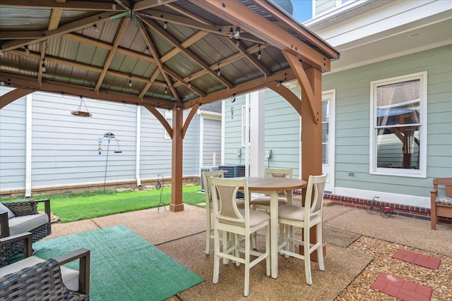 view of patio / terrace featuring outdoor dining area and a gazebo