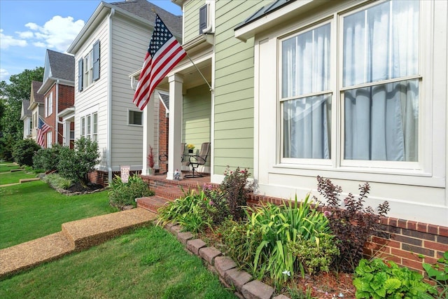 exterior space with a shingled roof and a yard