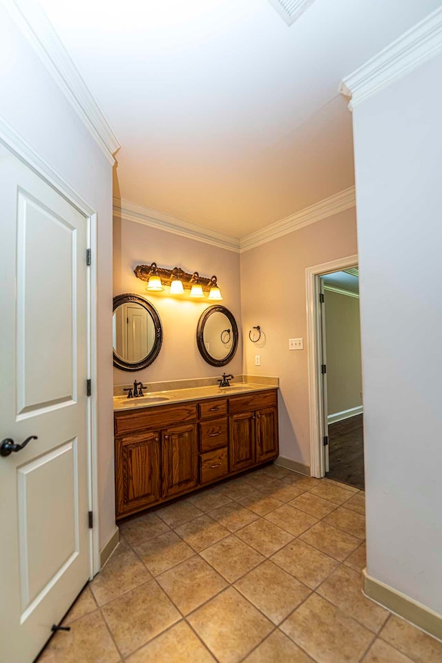 bathroom featuring vanity, tile patterned flooring, and ornamental molding