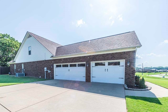 view of property exterior featuring a garage and a yard