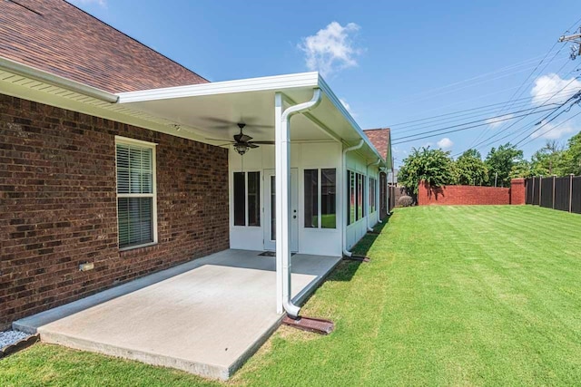 view of yard featuring ceiling fan and a patio area